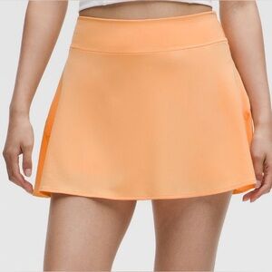Peach Rock Melon Lululemon lightweight high rise tennis skirt, size 6